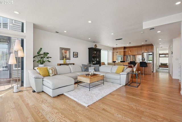 14569 NW Larson Rd Unit 13, Portland, OR 97231 - living room with healthy amount of natural light, light wood-type flooring, and recessed lighting