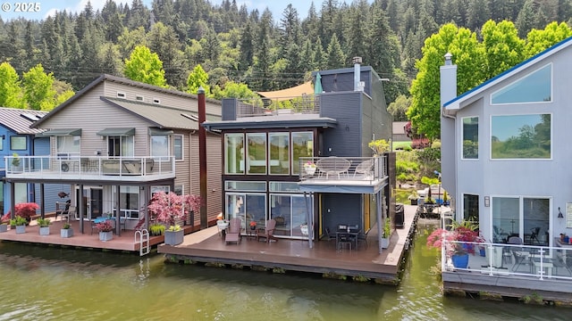 14569 NW Larson Rd Unit 13, Portland, OR 97231 - back of property with a wooded view, a deck with water view, and a balcony