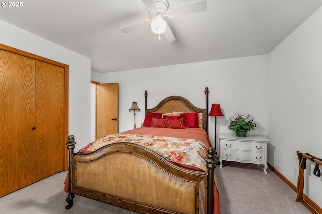 carpeted bedroom featuring ceiling fan, a closet, and baseboards