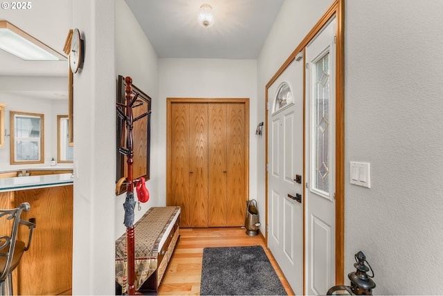 foyer with light wood-type flooring