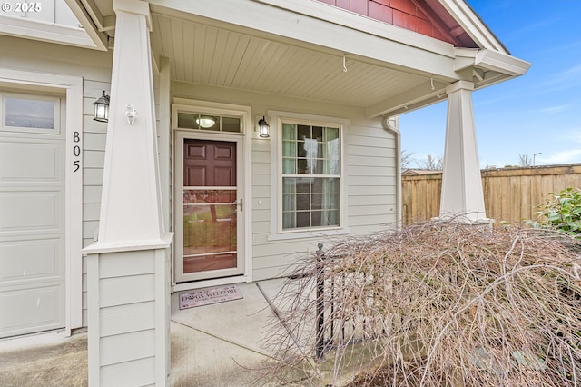 view of exterior entry with a garage