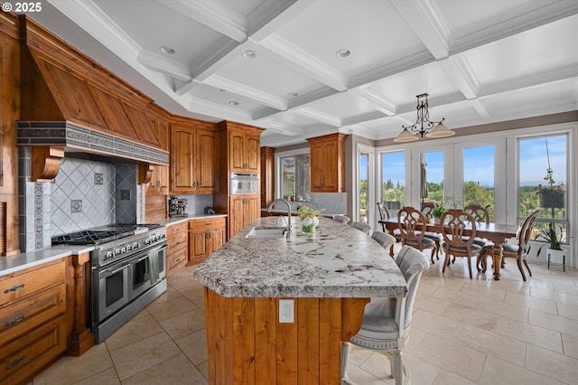 2650 Lorinda Ln, West Linn, OR 97068 - kitchen featuring range with two ovens, brown cabinets, tasteful backsplash, a sink, and beamed ceiling