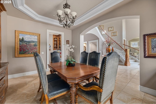 2650 Lorinda Ln, West Linn, OR 97068 - dining area with baseboards, arched walkways, a chandelier, stairway, and crown molding