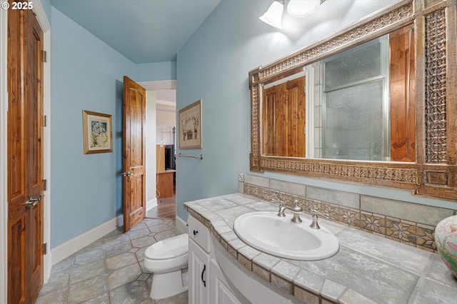 2650 Lorinda Ln, West Linn, OR 97068 - bathroom featuring toilet, vanity, a shower stall, and baseboards