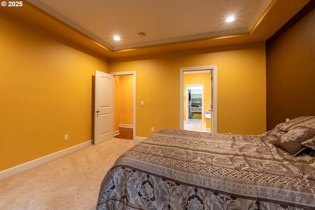 carpeted bedroom featuring crown molding, baseboards, a raised ceiling, and recessed lighting