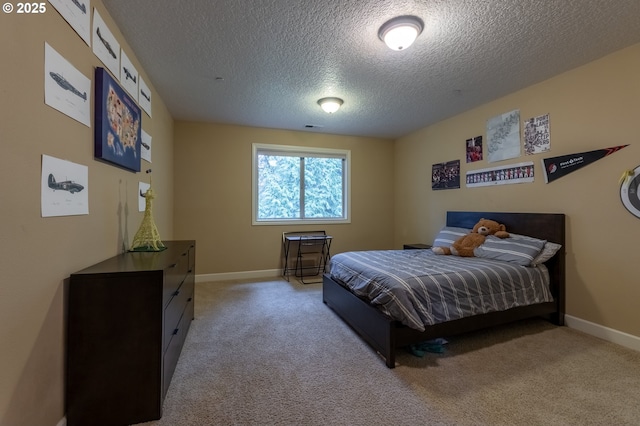 bedroom with carpet, visible vents, a textured ceiling, and baseboards