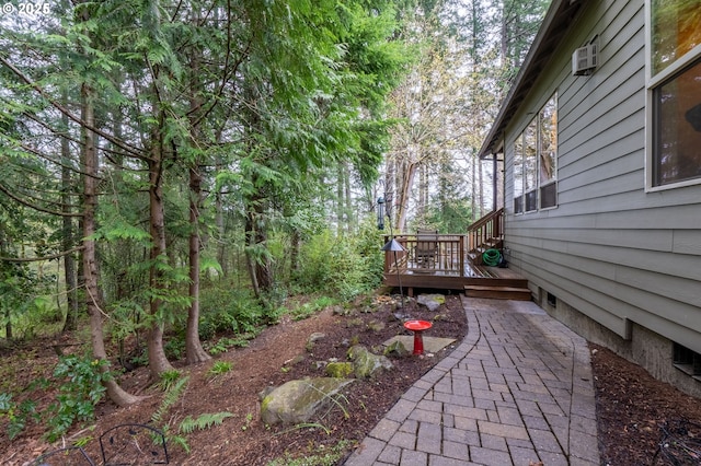 view of yard with a wooden deck