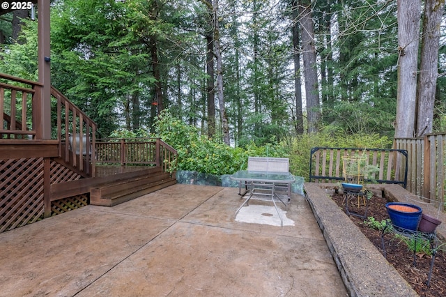 view of patio / terrace with a wooden deck and stairs