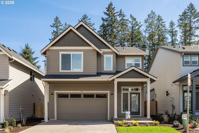 craftsman-style house with concrete driveway and a garage