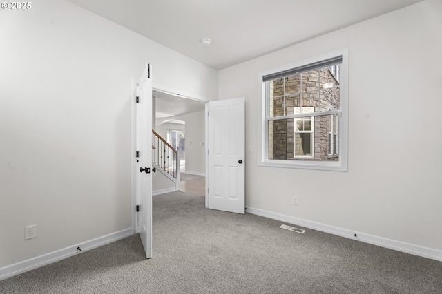 3504 NE Garfield St, Camas, WA 98607 - empty room with carpet, arched walkways, and a smoke detector