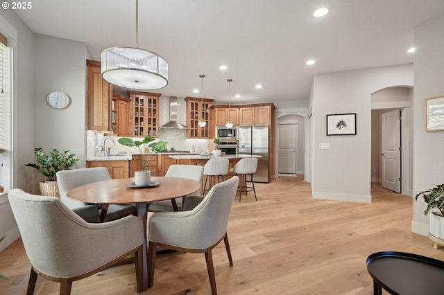 915 NE 36th Ave, Camas, WA 98607 - dining area with arched walkways, recessed lighting, and light wood finished floors
