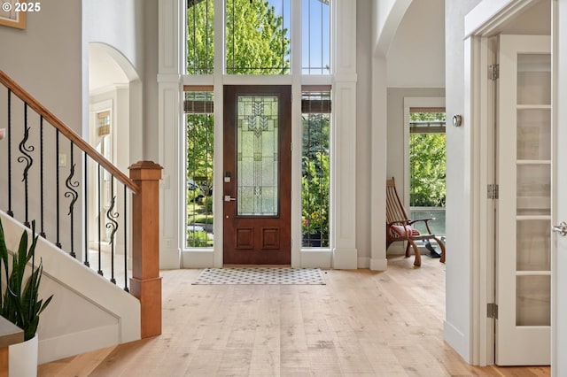 915 NE 36th Ave, Camas, WA 98607 - foyer with arched walkways, a high ceiling, and stairway