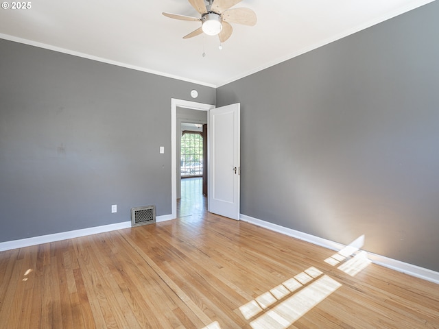 3310 NE 70th Ave, Portland, OR 97213 - spare room with light wood finished floors, ceiling fan, baseboards, and crown molding