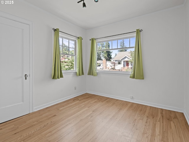 3310 NE 70th Ave, Portland, OR 97213 - empty room with light wood finished floors, baseboards, and ornamental molding