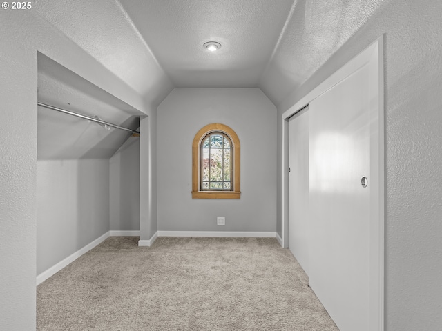 3310 NE 70th Ave, Portland, OR 97213 - unfurnished bedroom with a textured ceiling, carpet, and vaulted ceiling