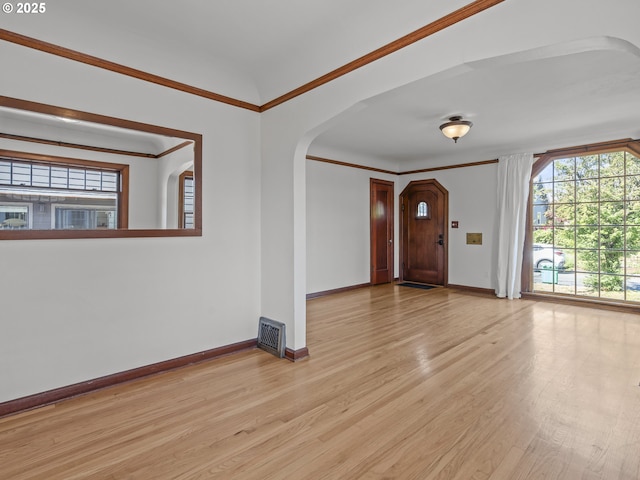 3310 NE 70th Ave, Portland, OR 97213 - entryway with arched walkways, light wood-style floors, baseboards, and crown molding