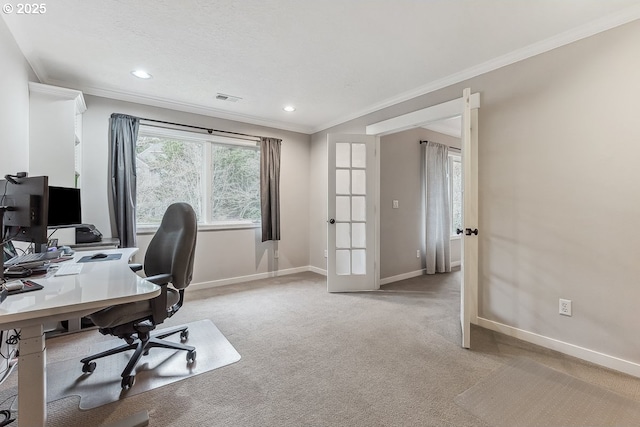 office area featuring french doors, crown molding, light colored carpet, visible vents, and baseboards