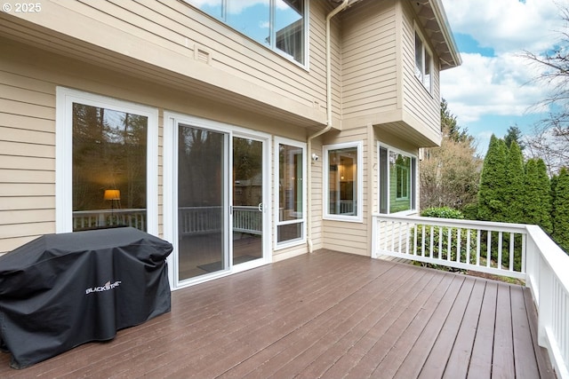 wooden terrace featuring area for grilling