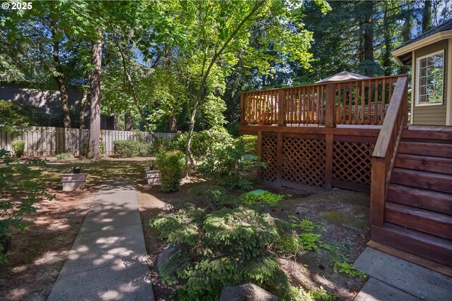 view of yard featuring a wooden deck