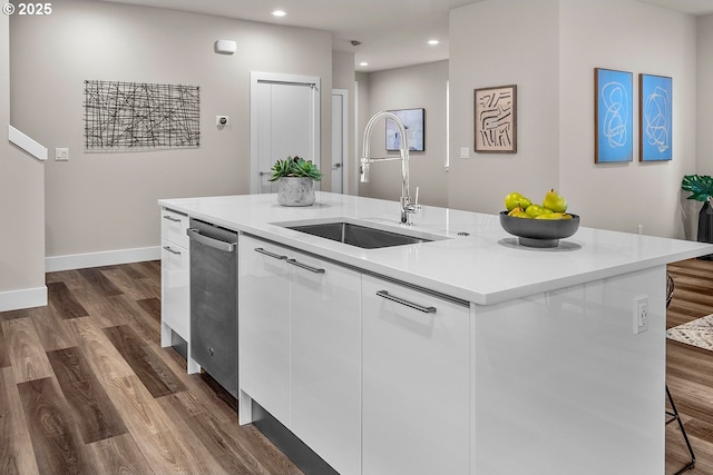 16779 SE Shimmering Leaf St, Happy Valley, OR 97086 - kitchen with white cabinets, dark wood finished floors, a center island with sink, and a sink