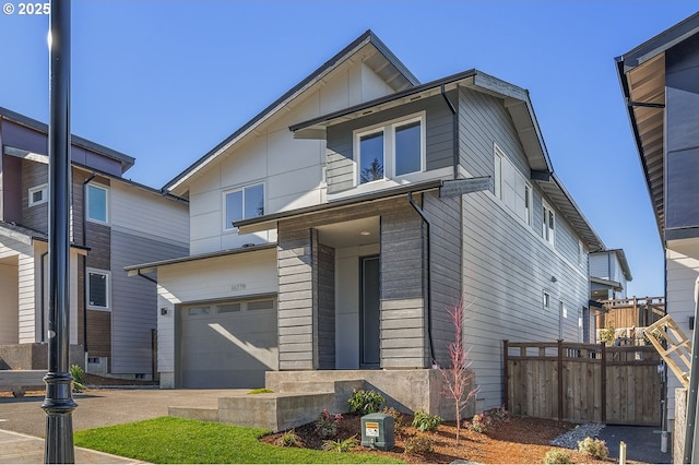 16779 SE Shimmering Leaf St, Happy Valley, OR 97086 - view of front of home with an attached garage and fence