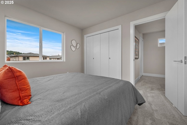 16779 SE Shimmering Leaf St, Happy Valley, OR 97086 - bedroom with carpet floors, baseboards, and a closet