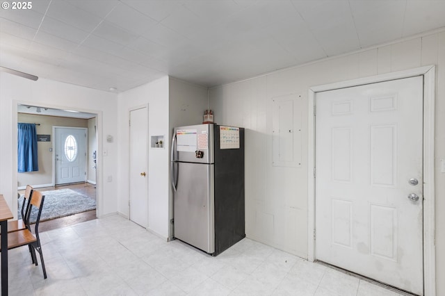 kitchen with freestanding refrigerator