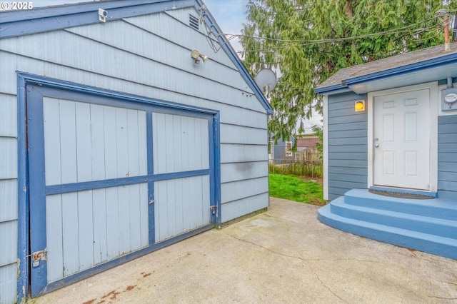 garage featuring fence