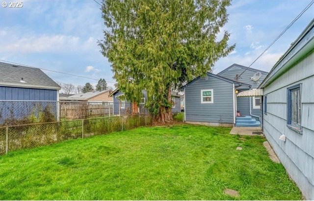 view of yard with fence