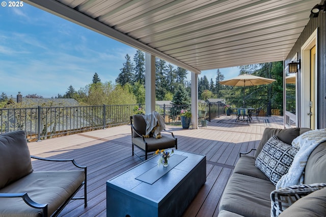 wooden deck featuring outdoor dining area and outdoor lounge area