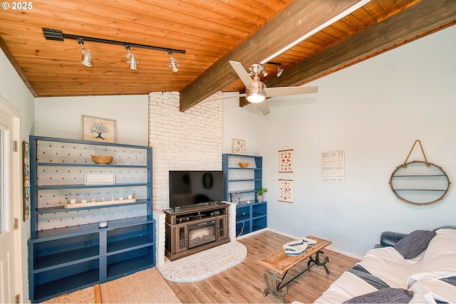 535 SW Cardinal St, Depoe Bay, OR 97341 - living area featuring track lighting, wood ceiling, wood finished floors, and a ceiling fan