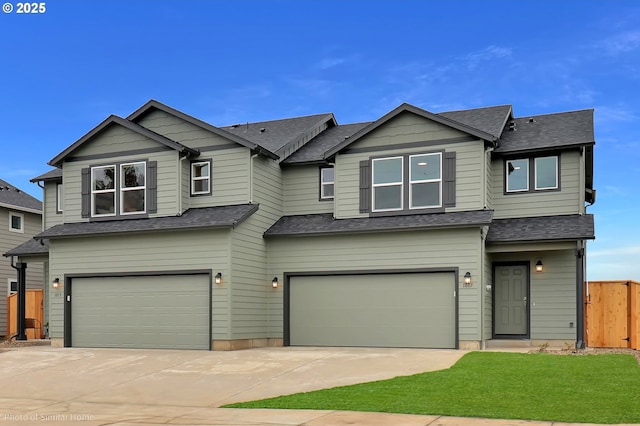 1033 Sommerville Loop, Harrisburg, OR 97446 - view of front facade featuring an attached garage, driveway, and roof with shingles