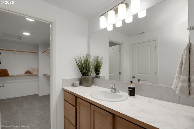 1033 Sommerville Loop, Harrisburg, OR 97446 - bathroom featuring vanity and a spacious closet