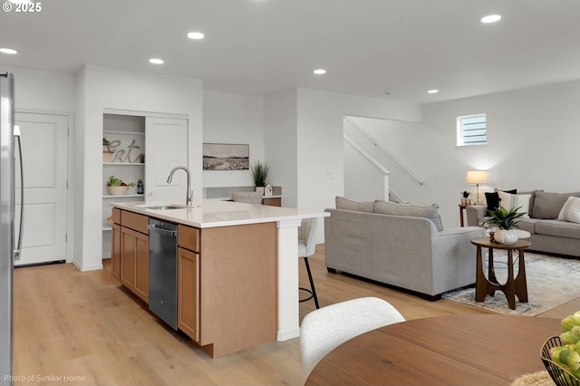 1033 Sommerville Loop, Harrisburg, OR 97446 - kitchen featuring a sink, open floor plan, light wood-type flooring, appliances with stainless steel finishes, and recessed lighting