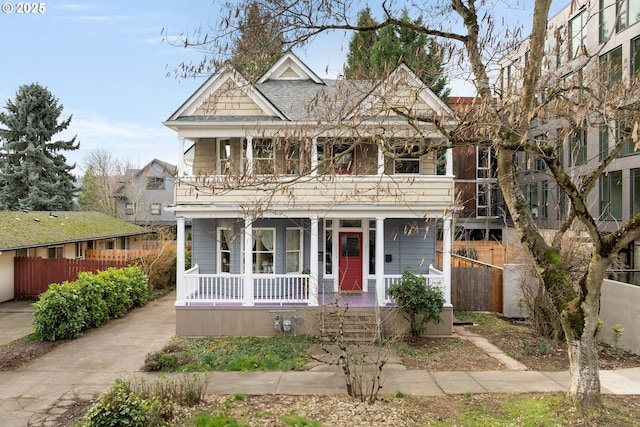 view of front of house with covered porch and fence