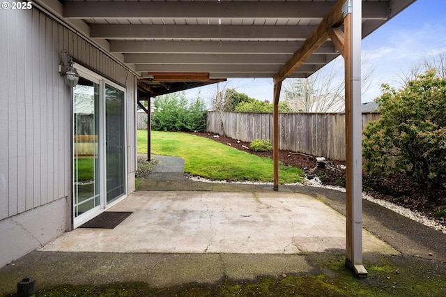 view of patio featuring fence