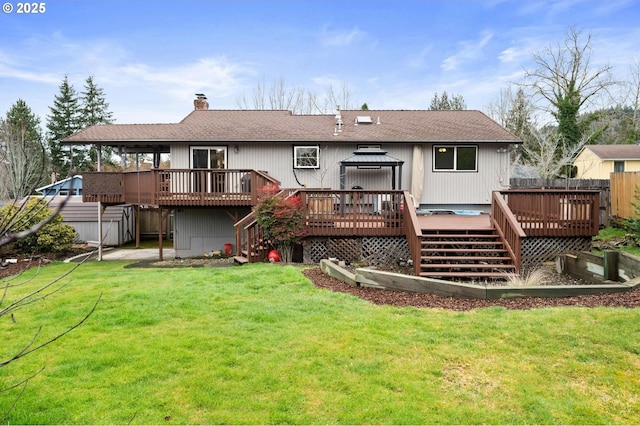 rear view of property with a gazebo, a lawn, a wooden deck, and stairs