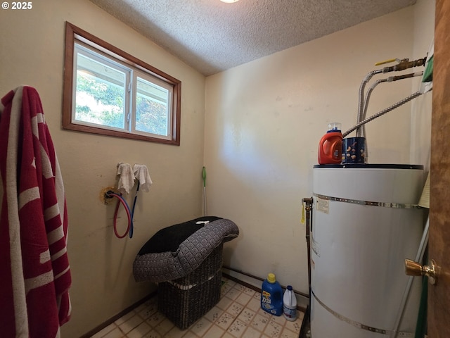 4545 Ridenour St, Roseburg, OR 97470 - laundry room with strapped water heater, light flooring, and a textured ceiling