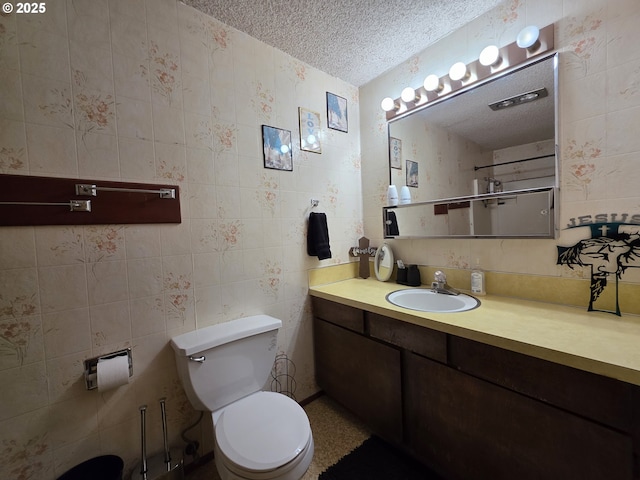 4545 Ridenour St, Roseburg, OR 97470 - bathroom featuring a textured ceiling, vanity, a shower, and tile walls