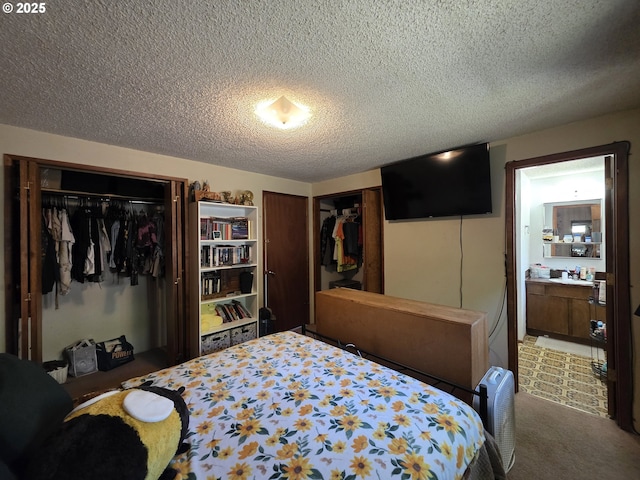 4545 Ridenour St, Roseburg, OR 97470 - carpeted bedroom with a textured ceiling, two closets, and ensuite bathroom