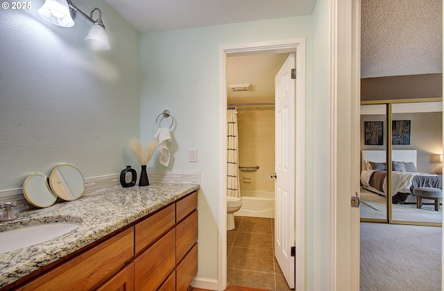 5545 E Evergreen Blvd Unit 6203, Vancouver, WA 98661 - ensuite bathroom with tile patterned floors, vanity, toilet, and shower / bathtub combination with curtain