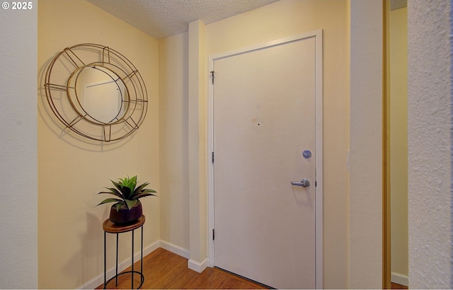 5545 E Evergreen Blvd Unit 6203, Vancouver, WA 98661 - entrance foyer featuring a textured ceiling, wood finished floors, and baseboards