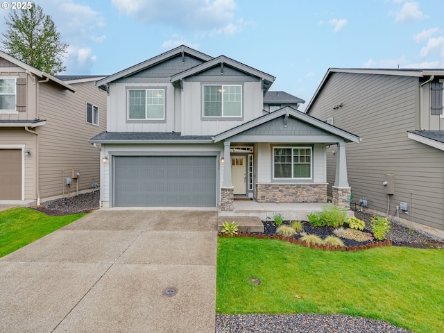 6820 N 89th Loop, Camas, WA 98607 - craftsman inspired home featuring board and batten siding, concrete driveway, a garage, a front yard, and stone siding