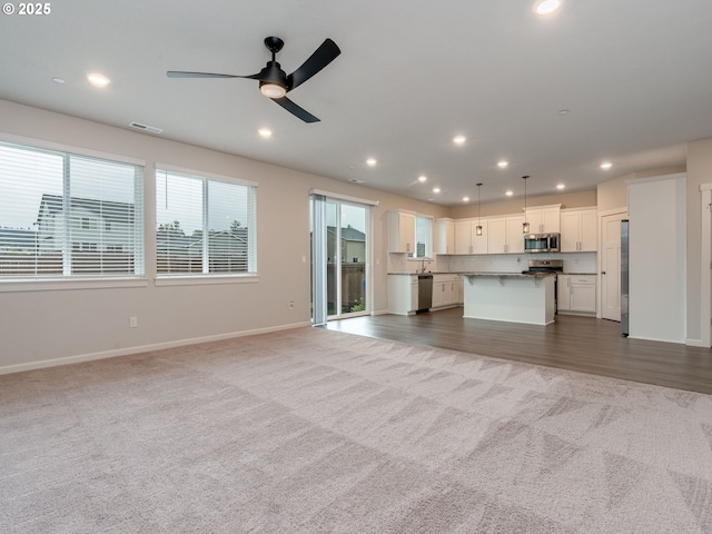 6820 N 89th Loop, Camas, WA 98607 - unfurnished living room with carpet, a ceiling fan, and recessed lighting