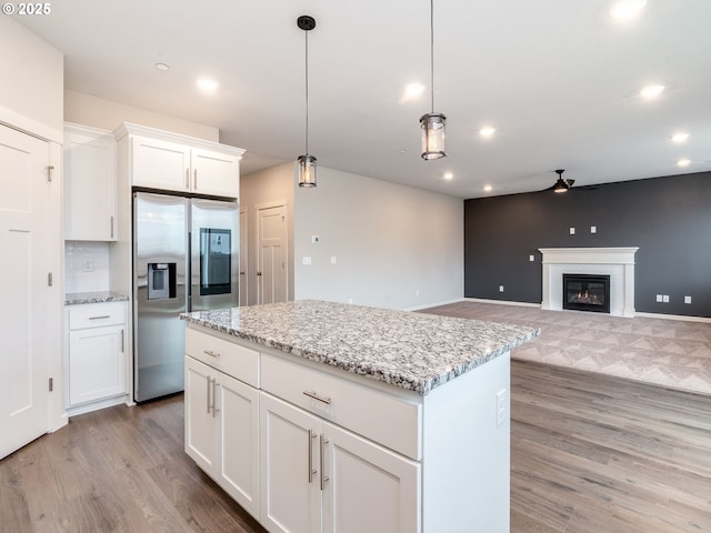 6820 N 89th Loop, Camas, WA 98607 - kitchen with stainless steel refrigerator with ice dispenser, light wood-style flooring, ceiling fan, recessed lighting, and a center island