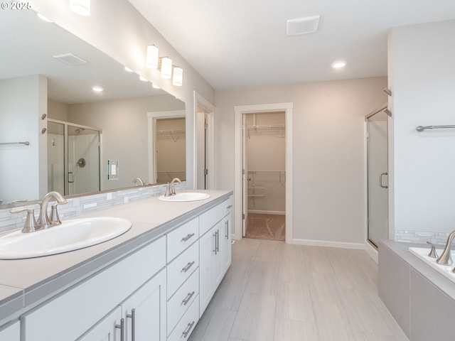 6820 N 89th Loop, Camas, WA 98607 - full bathroom with a shower stall, a spacious closet, double vanity, a bath, and recessed lighting