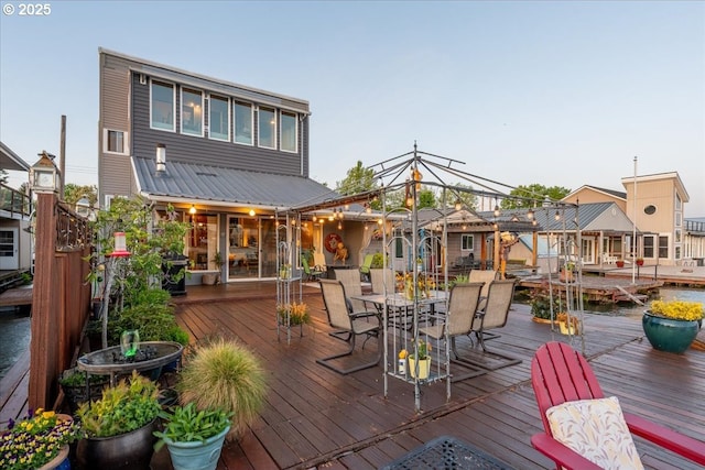 deck with outdoor dining area