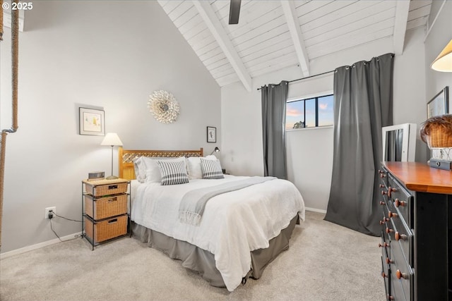 bedroom with light colored carpet, baseboards, wood ceiling, and beam ceiling