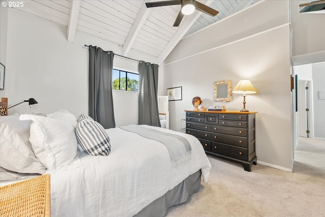bedroom featuring ceiling fan, light colored carpet, baseboards, vaulted ceiling with beams, and wood ceiling