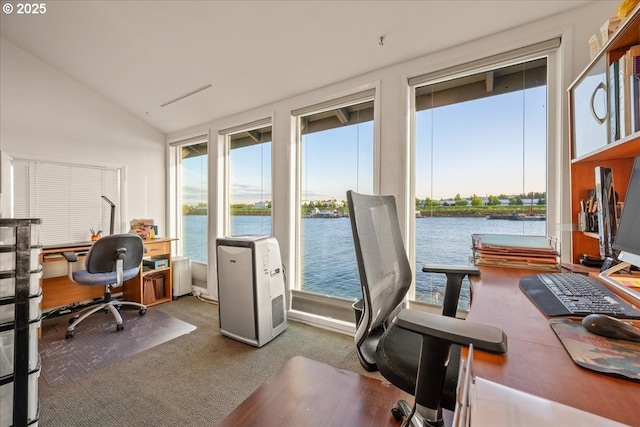 home office with carpet, a water view, and vaulted ceiling